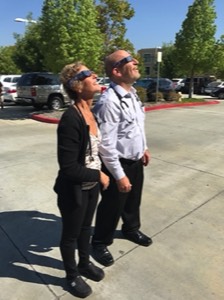 Photo of Drs. Daphne and Paul looking at Solar eclipse.